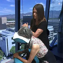 Woman practicing mobile massage therapy in LA